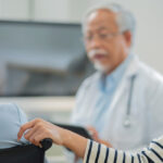 Family discussing affordable family primary care options with a healthcare provider